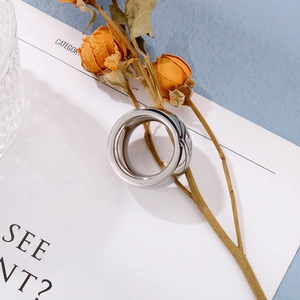 Top view of a chunky polished stainless steel ring with a smooth mirror finish