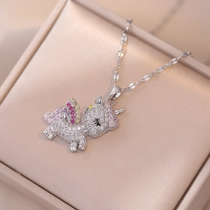 Macro shot of silver unicorn pendant with colorful crystals in a luxury jewelry box