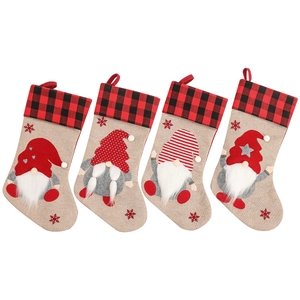 Set of 4 Christmas stockings with Nordic gnomes and red black plaid cuffs for holiday decor