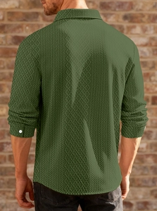 Detail of knitted olive green shirt showing geometric diamond texture and back fit