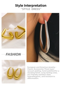 Macro detail of gold and silver stainless steel C-shape earrings with triple vacuum plating