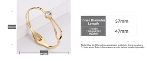 Detailed view of gold plated titanium steel bangle with single crystal and size parameters