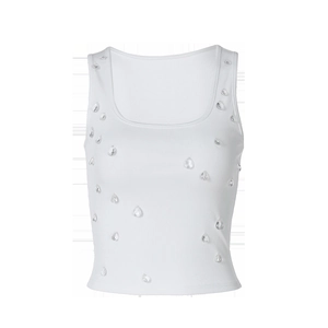 Macro shot of white ribbed tank top featuring delicate droplet-shaped beadwork detail