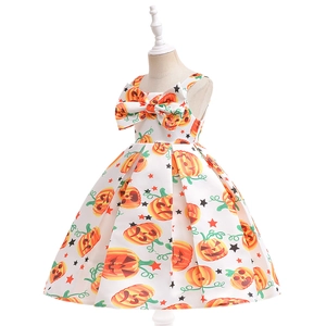 Detail of Halloween girls dress with pumpkin print and large 3D bow on the front