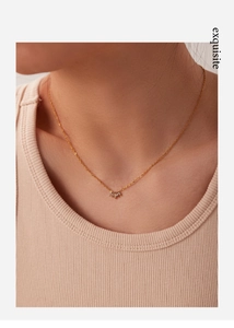 Exquisite 18k gold plated titanium necklace with cubic zirconia pendant on model neck