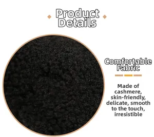 Gros plan sur la texture du tissu en cachemire d'agneau noir de la peluche mouton