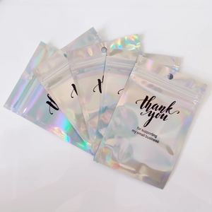 Five holographic rainbow thank you packaging bags with resealable zip and hang holes