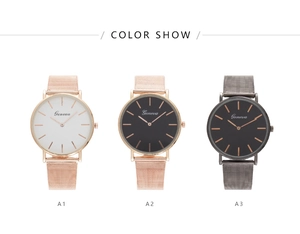 Detailed comparison of quartz watches in rose gold and grey finishes with mesh straps