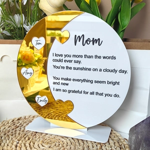 Detail of custom moon-shaped acrylic Mother's Day gift with gold mirror finish