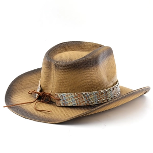 Close-up of woven straw cowboy hat with vintage metal studs and braided decorative band