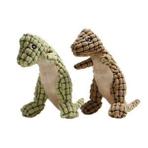 Close-up of corn grain texture fabric and plush material on dinosaur dog toys