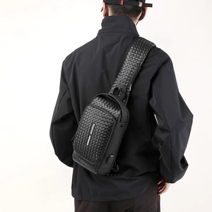 Men's black woven chest bag with USB port and password lock for secure travel storage