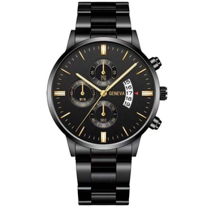 Detail of multi-functional black chronograph watch with gold accents and date window