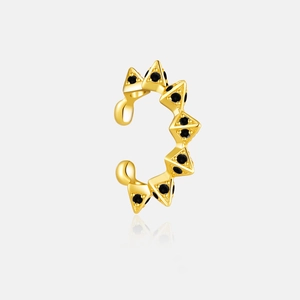 Macro view of 925 silver ear cuff with gold plating and black studded rivet pyramids