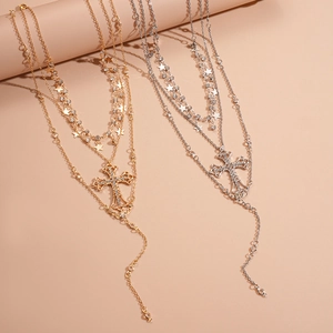 Three-layer necklace set featuring rhinestone cross and star pendants in gold and silver