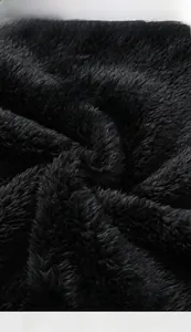 Close-up of premium black polar fleece fabric with soft texture for winter hoodies