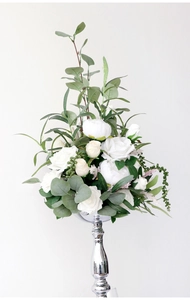 Macro detail of artificial white roses and peonies on a silver metallic floral stand