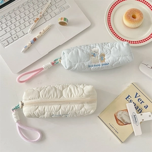 Quilted blue and white fabric pencil cases with cute alpaca embroidery and handle