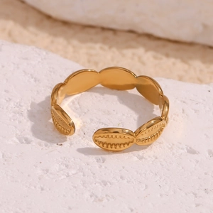 Detail of 18K gold-plated adjustable stainless steel ring with textured oval patterns