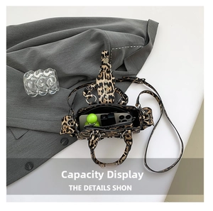 Internal view of leopard print crossbody bag showing space for phone and essentials