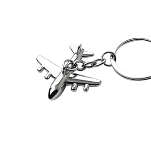 Polished silver metal airplane keychain with a sturdy ring on a clean white background