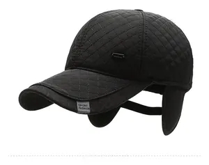 Close-up of quilted black baseball cap with ear flaps and Sport Fashion label detail