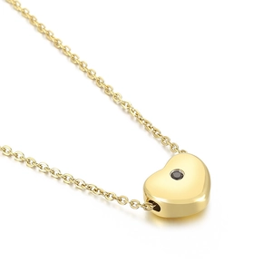 Minimalist gold stainless steel puffy heart necklace with black stone on white background