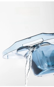 Transparent blue bidet with rear overflow holes showing dynamic drainage for daily hygiene