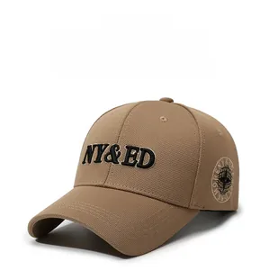 Close-up detail of khaki baseball cap with NY&ED 3D embroidery and compass patch
