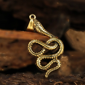 Elegant gold snake pendant necklace featuring intricate scale textures and metallic luster