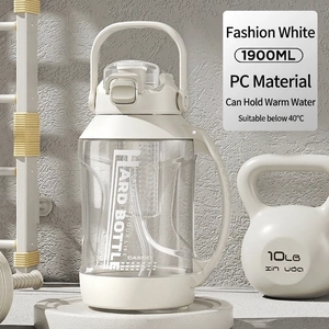 Close-up of 1900ml white sports bottle with portable handle and fitness equipment background