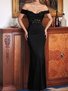 Elegant off-shoulder black evening gown with lace patchwork and slimming mermaid silhouette
