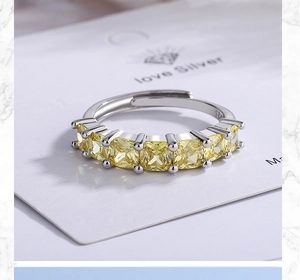 Close-up of S925 sterling silver ring featuring seven yellow square-cut zircon stones