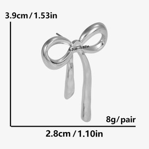 Detailed view of silver bow earrings with measurements 3.9cm x 2.8cm on white background