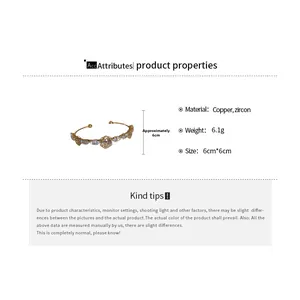 Detail showing 14k gold plated bangle dimensions 6cm by 6cm with zircon floral pattern
