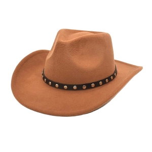 Macro view of wool felt cowboy hat detailing the black leather band and gold metal studs