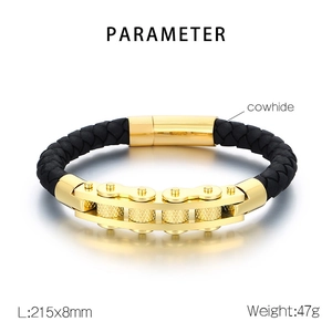 Detailed view of black cowhide leather and gold gear chain bracelet with specs