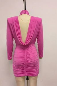 Detail of hot pink backless dress with glittering rhinestones and elegant ruched fabric