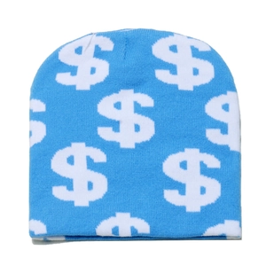Detail of blue knitted beanie featuring all-over white dollar sign pattern and texture