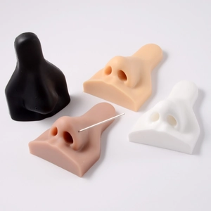 Silicone nose model set in four skin tones for piercing display and practice tool