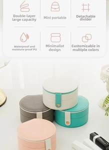 Close-up of double-layer semi-circular jewelry box with removable dividers and PU leather