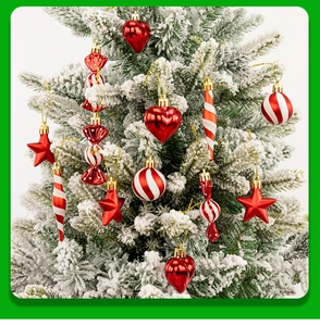 Close-up of red and white Christmas tree ornaments including stars, hearts, and candy canes