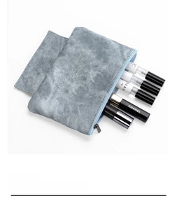 Detail of the blue marble texture fabric and metal zipper on the large storage bag