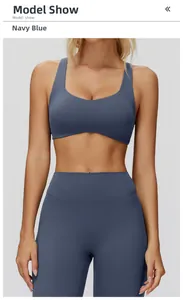Detail view of navy blue yoga set with cross-back sports bra and high-waisted leggings