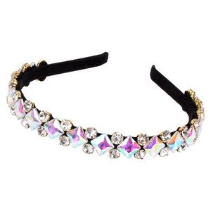 Elegant black headband with large aurora rhinestones and clear crystals on white background