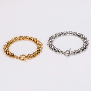 Detail view of gold and silver stainless steel chunky chain bracelets with OT toggle clasps