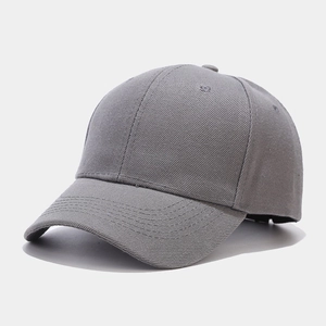 Close-up of gray cotton twill baseball cap showing six-panel structure and vent holes