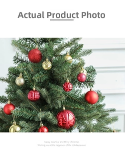 Close-up of red and gold Christmas ornaments with glitter and matte finishes on a tree