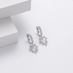 Detailed macro of S925 sterling silver heart earrings with sparkling cubic zirconia accents