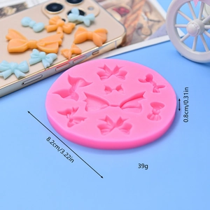 Pink silicone bow mold with 9 cavities for fondant cake decoration and DIY crafts